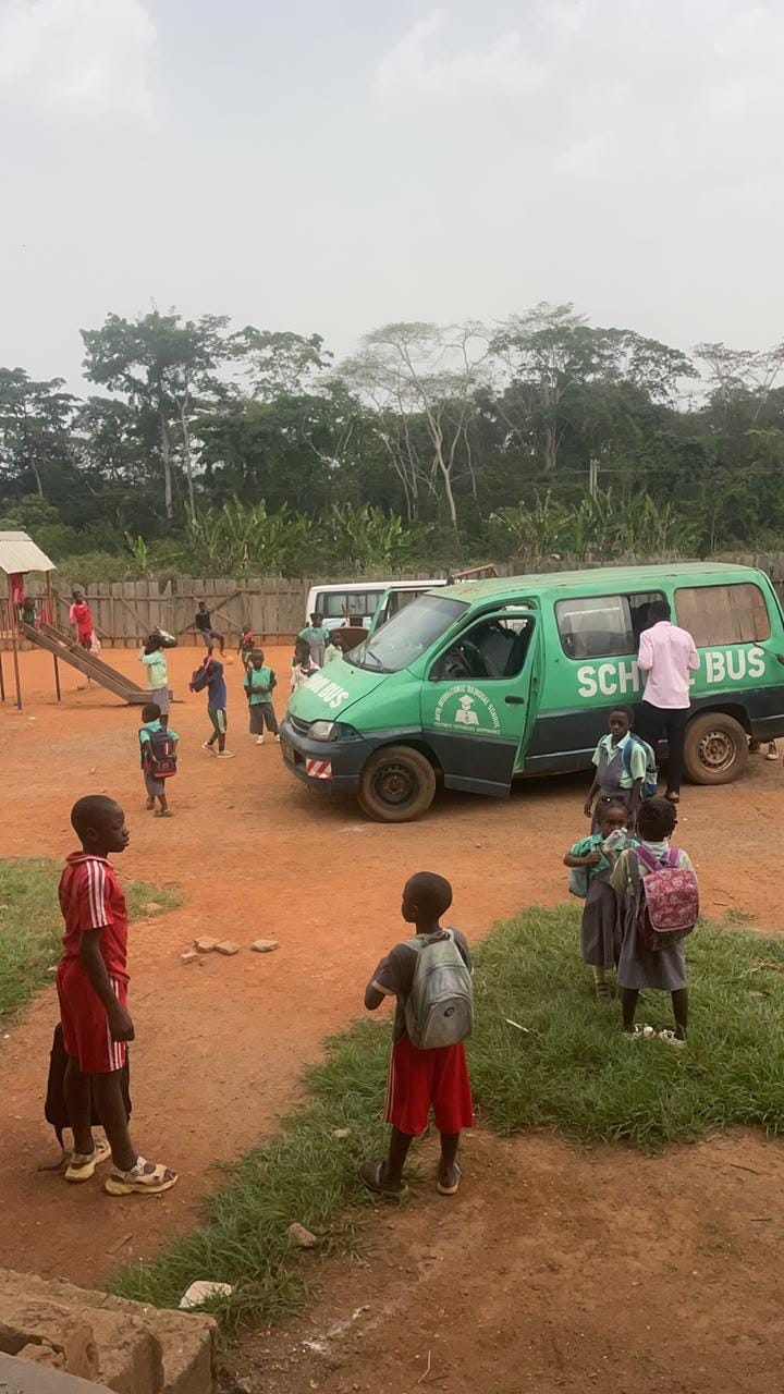 The MIYA school bus with students in the playground