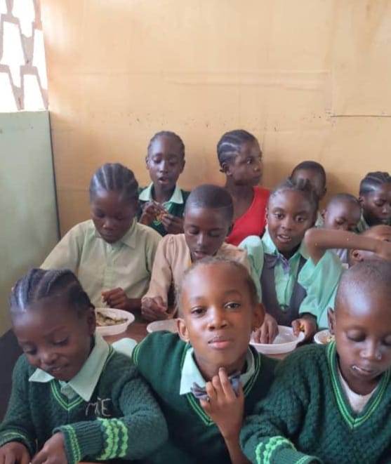 MIYA students sharing a school lunch together